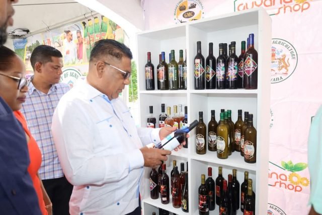 Agriculture Minister Zulfikar Mustapha examines a product at the Agriculture Village