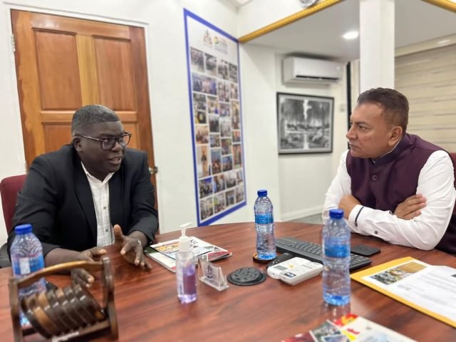 Chief Investment Officer, Dr Peter Ramsaroop listens to Telztar Suites Inc Director, Kenwin Charles during the signing of the Investment Agreement on Friday