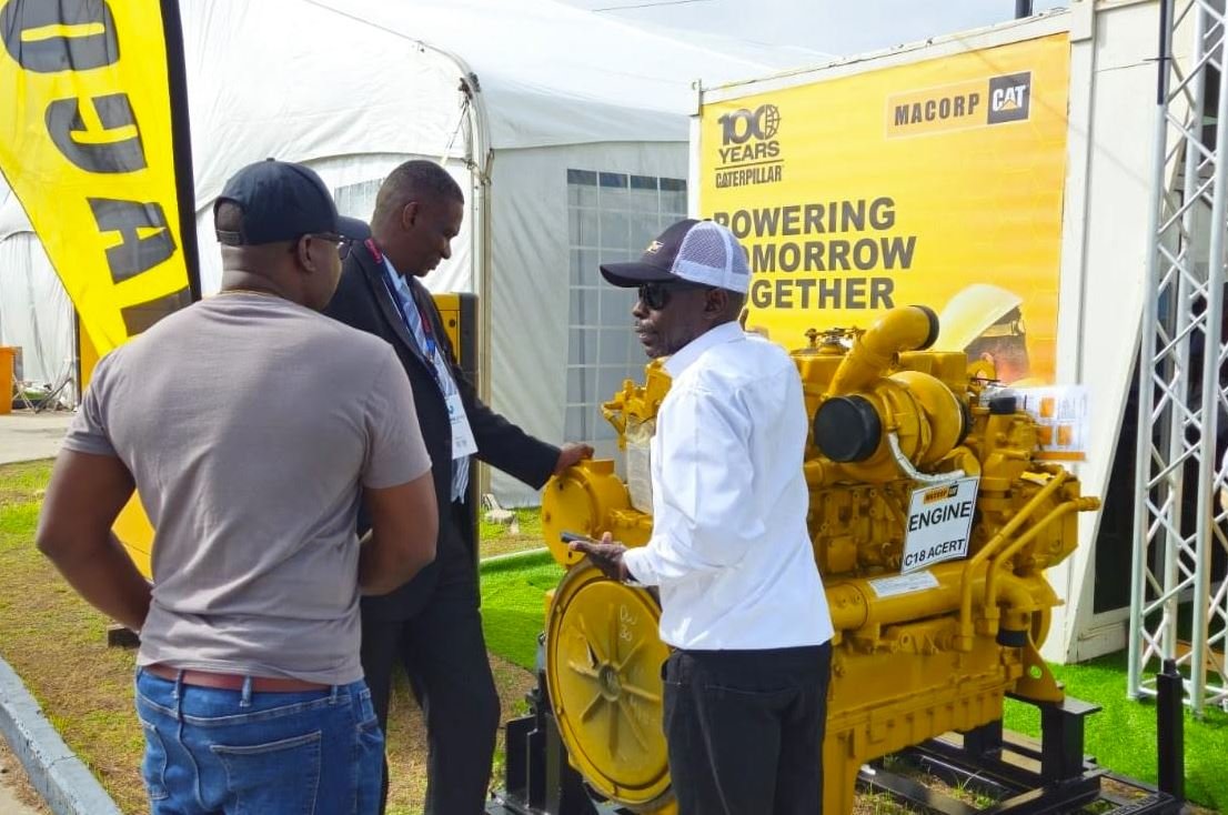 Energy Conference attendees examining MACORP's C18 ACERT Caterpillar engine