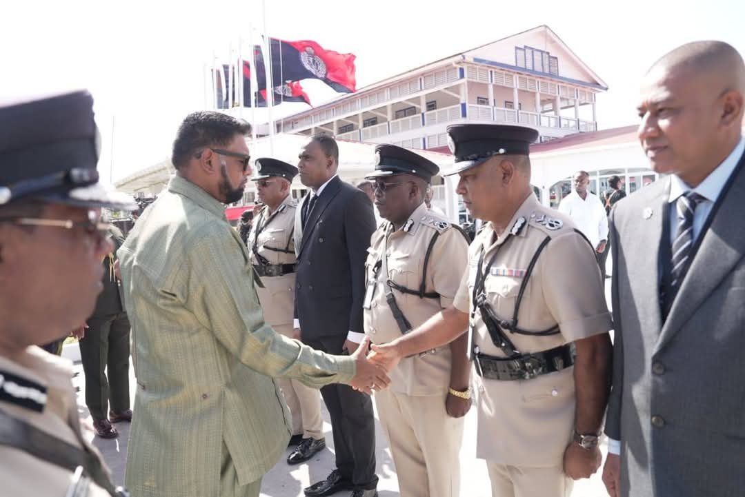 President Dr Irfaan Ali greets an officer at the conference at Eve Leary this morning