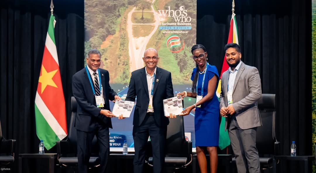 A happy display of an agreement at the recently concluded International Business Conference in Suriname
