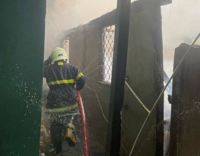 A firefighter battling the blaze