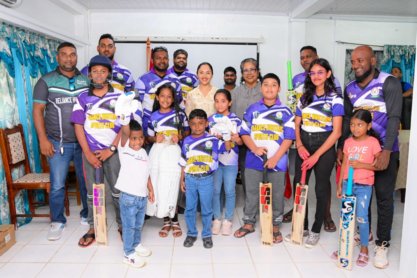 First Lady Arya Ali with members of the Reliance Hustlers Sports Club
