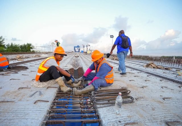Men busy at work on the bridge 