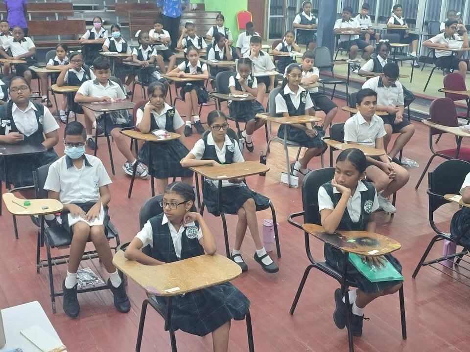 Students of Mae's Primary sitting the exams at the GWLT at UG