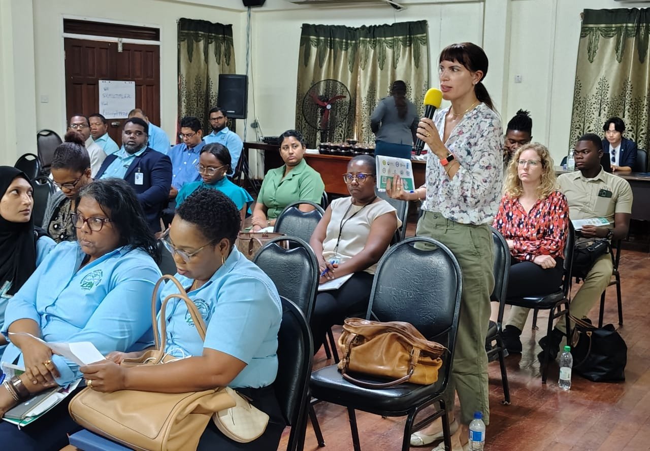 A person in the audience speaks at the launch