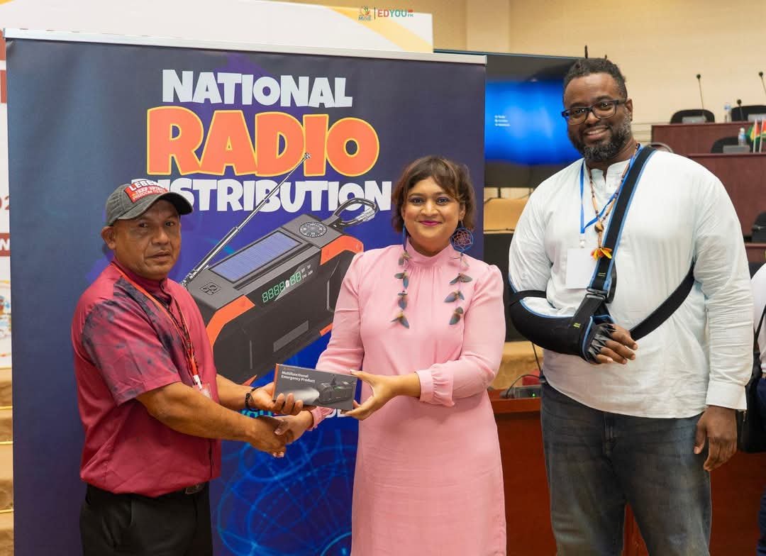 Minister of Education, Priya Manickchand and Head of EdYou FM, Phillip Williams, handing over radio