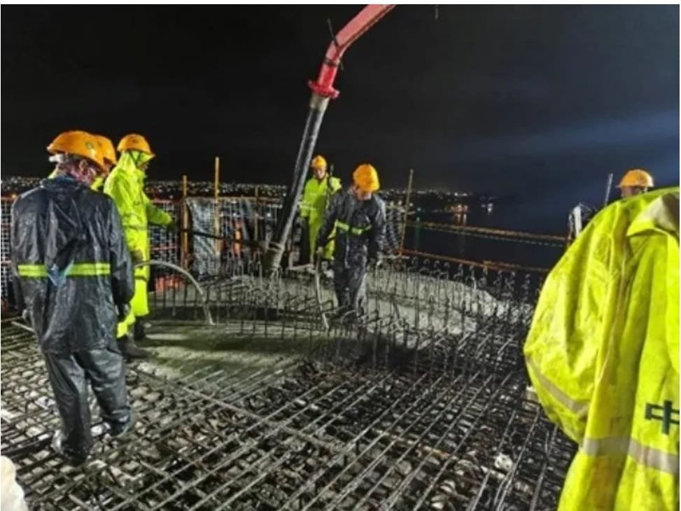 Men busy at work on the bridge