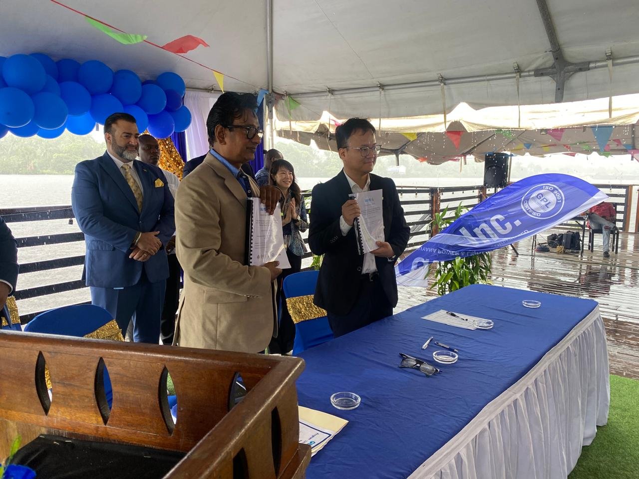 Representatives display the contracts signed