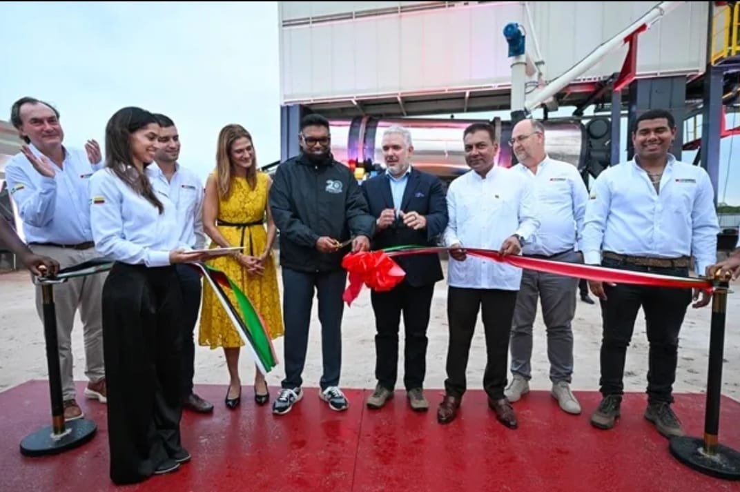 President Ali cuts the ceremonial ribbon to formally open the plant