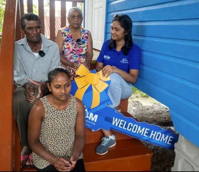 Sham Persaud and family with a MoM representative