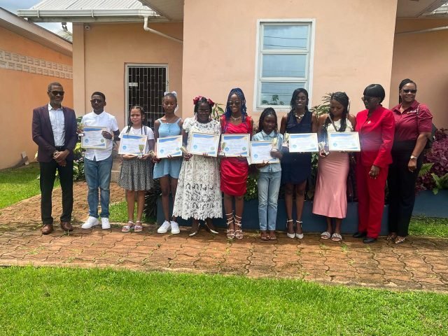Officials with the students honoured