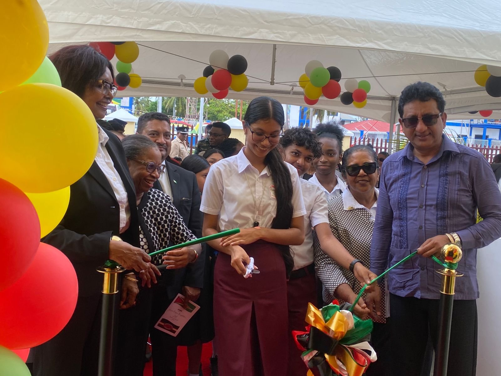 The cutting of the ceremonial ribbon to officially open the court at Anna Regina