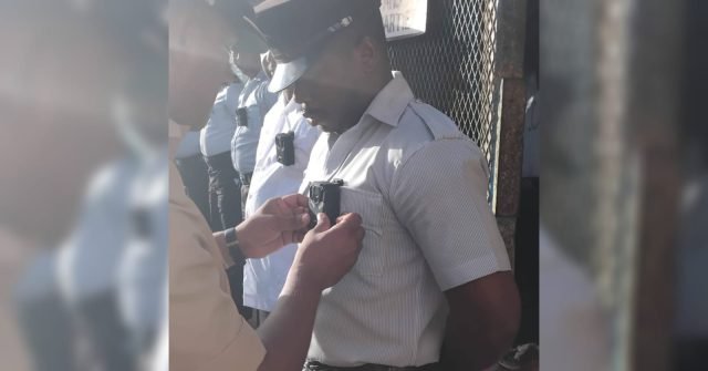 Prison officers equipped with body cameras
