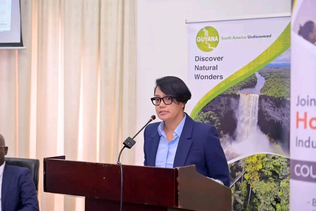 Minister Susan Rodrigues speaking at podium