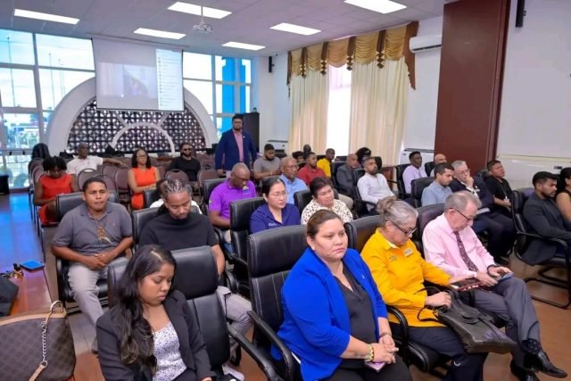 People sitting at a section of the gathering at the meeting