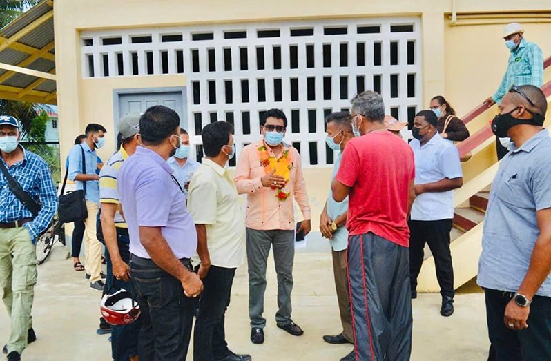 Attorney General Anil Nandlall interacting with Cotton Tree residents