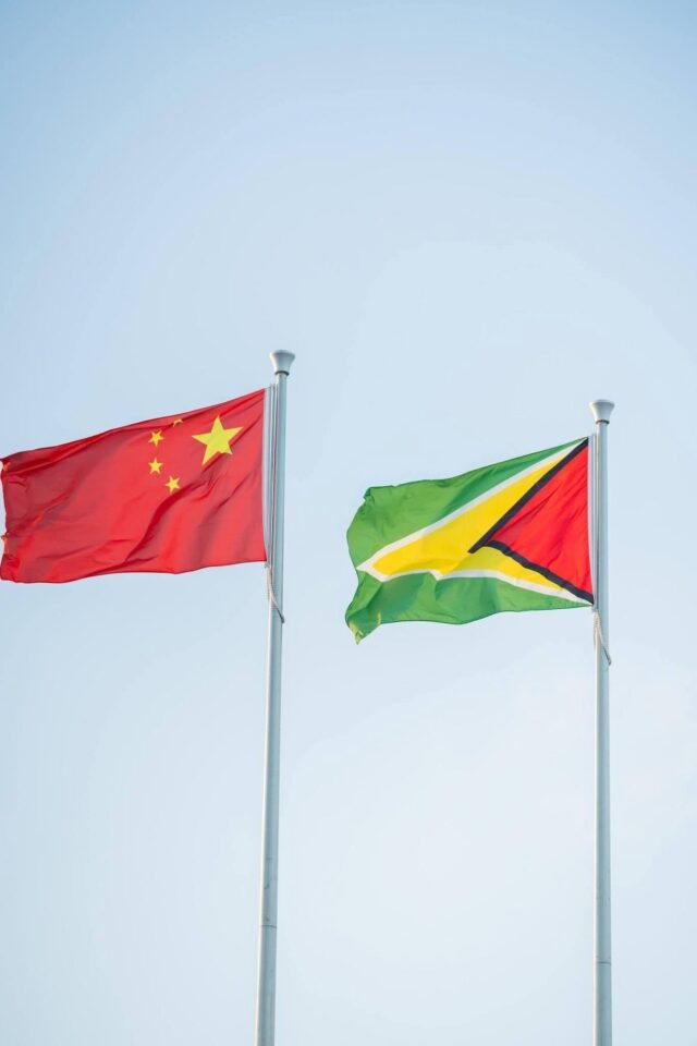 The flags of the two nations flutter in the wind